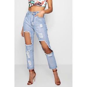 Distressed slashed knee ripped boyfriend jeans